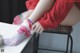 A little girl sitting on a chair with her feet on a table.