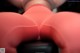 A close up of a woman's butt in red tights.